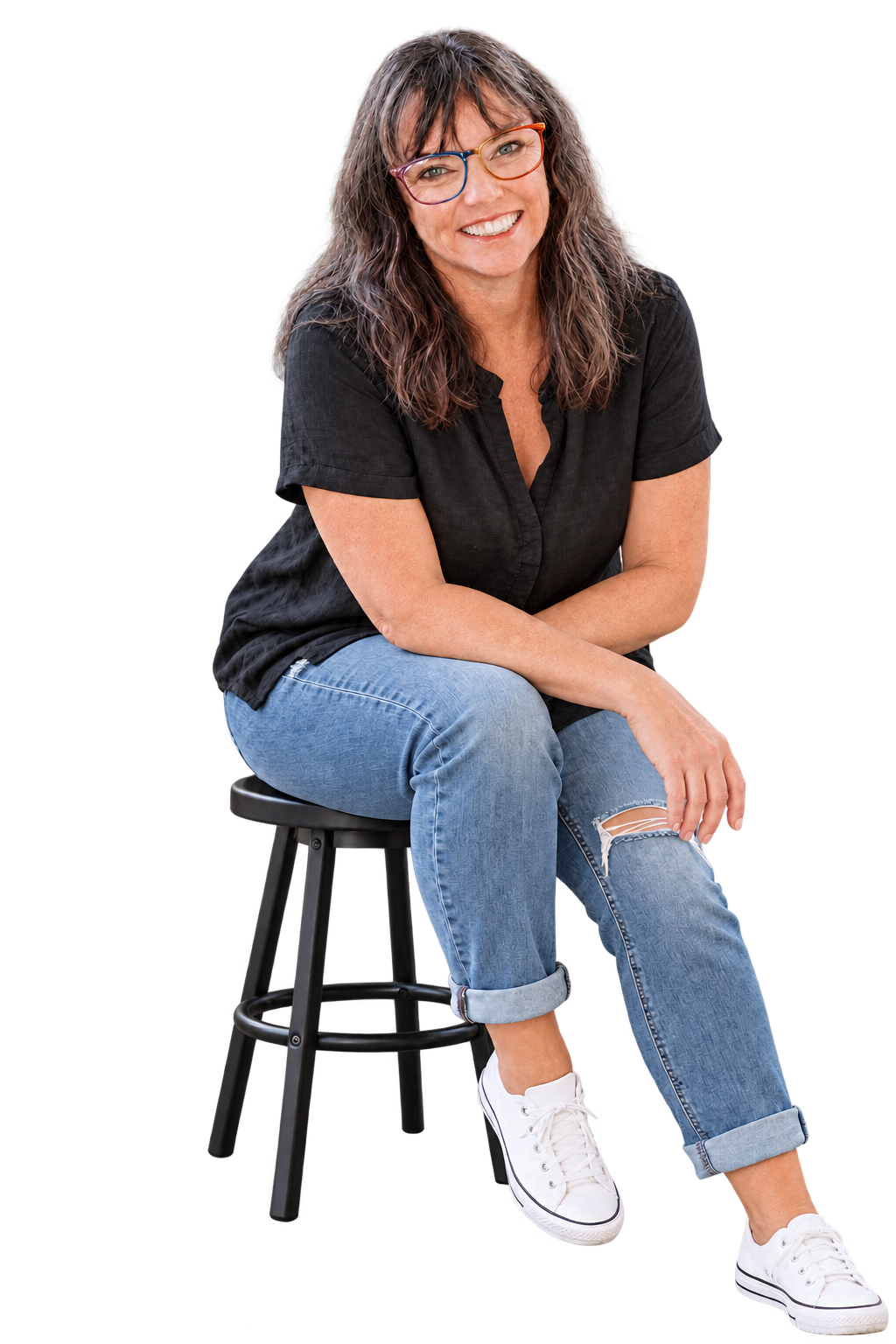 Dana Sacco seated casually, smiling